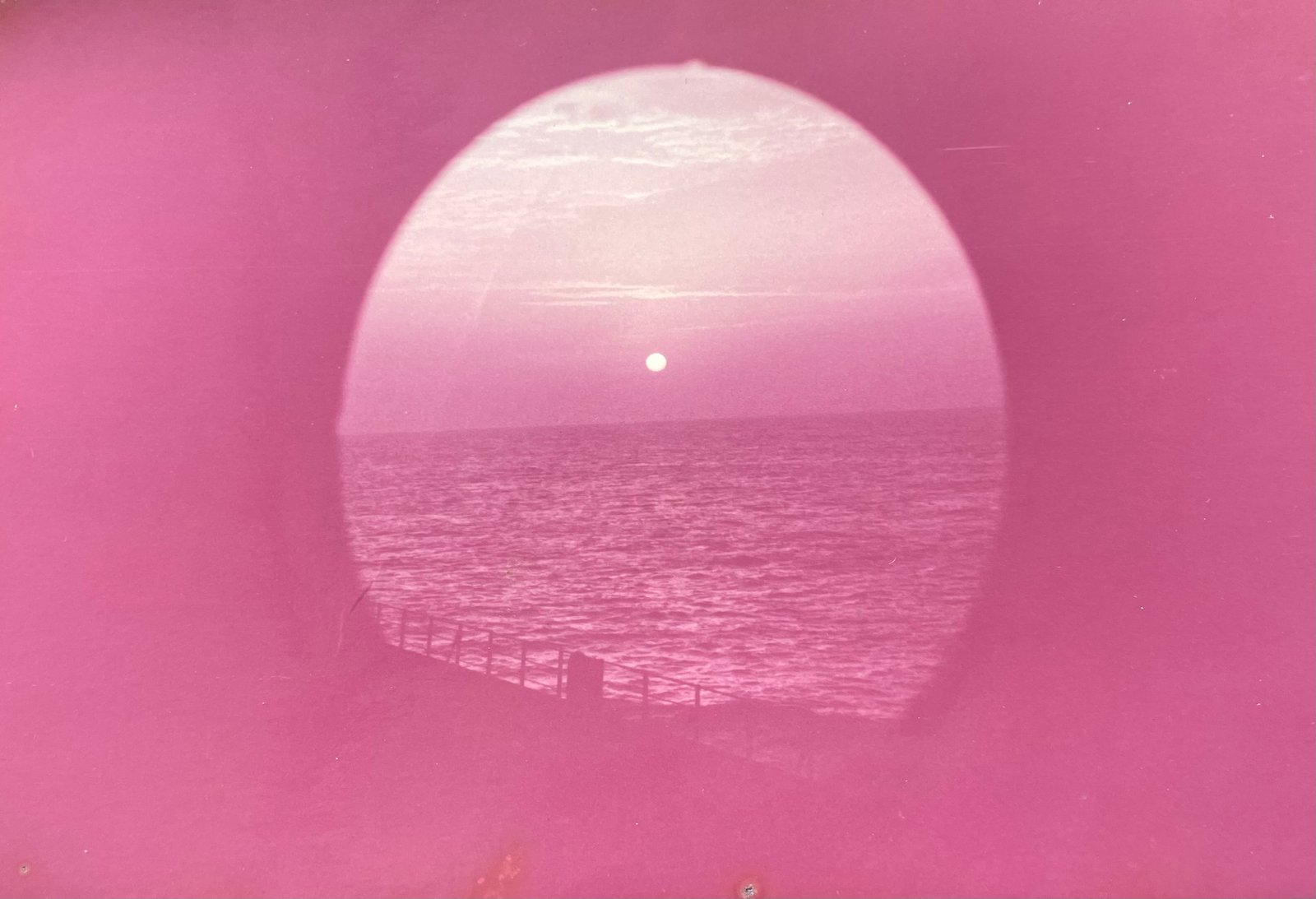Sunset through a ship porthole